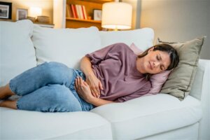 Woman with stomach cramps